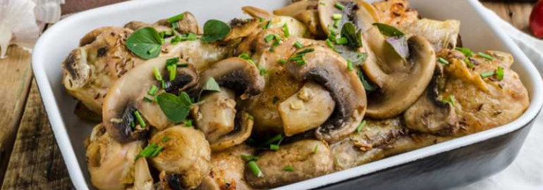Куриные бедра с грибами в духовке